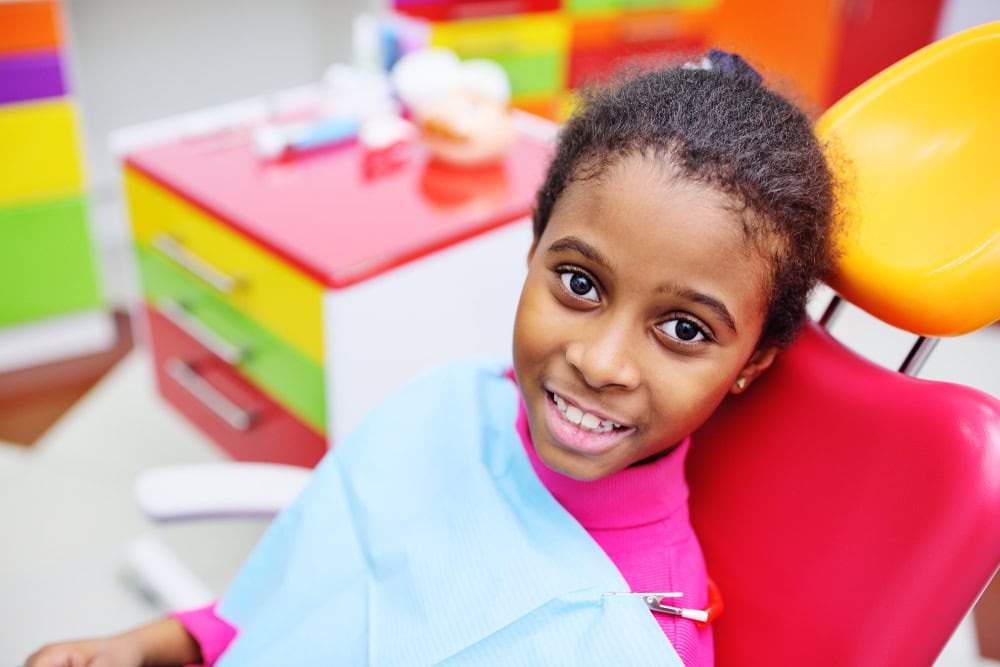 smiling woman showing healthy teeth after dental visit